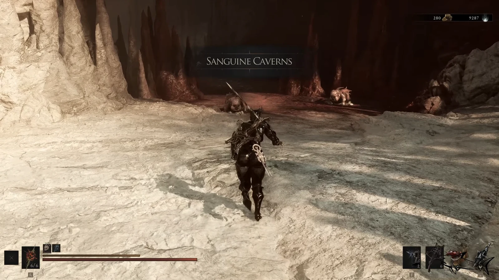 The Sanguine Caverns area title appears as the armored character moves toward enemies in the cavern