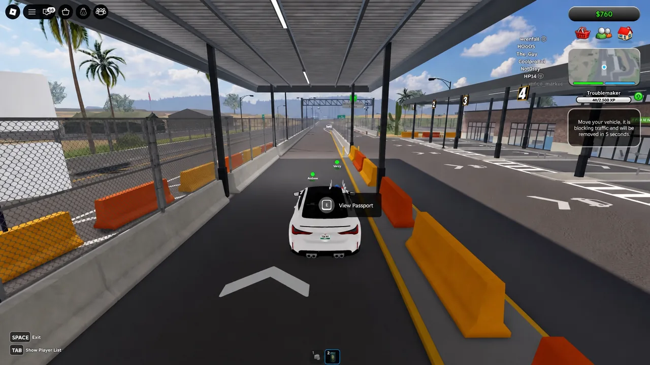 Driving view with the E View Passport prompt shown over the car at the border crossing