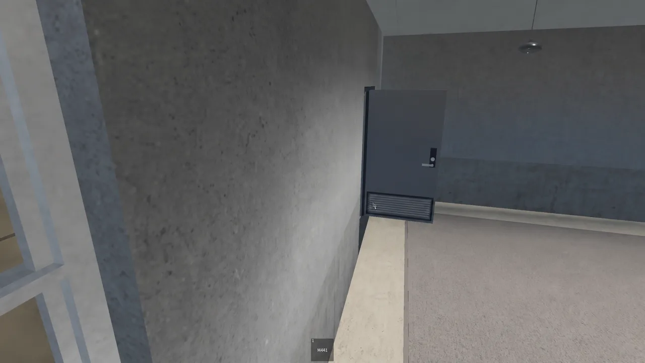 First-person view of a closed gray door inside the Docks building with the M4A1 equipped