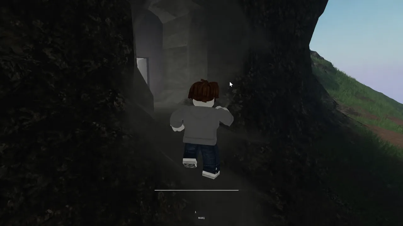 Player entering the rocky cave entrance that leads down to the hidden laboratory