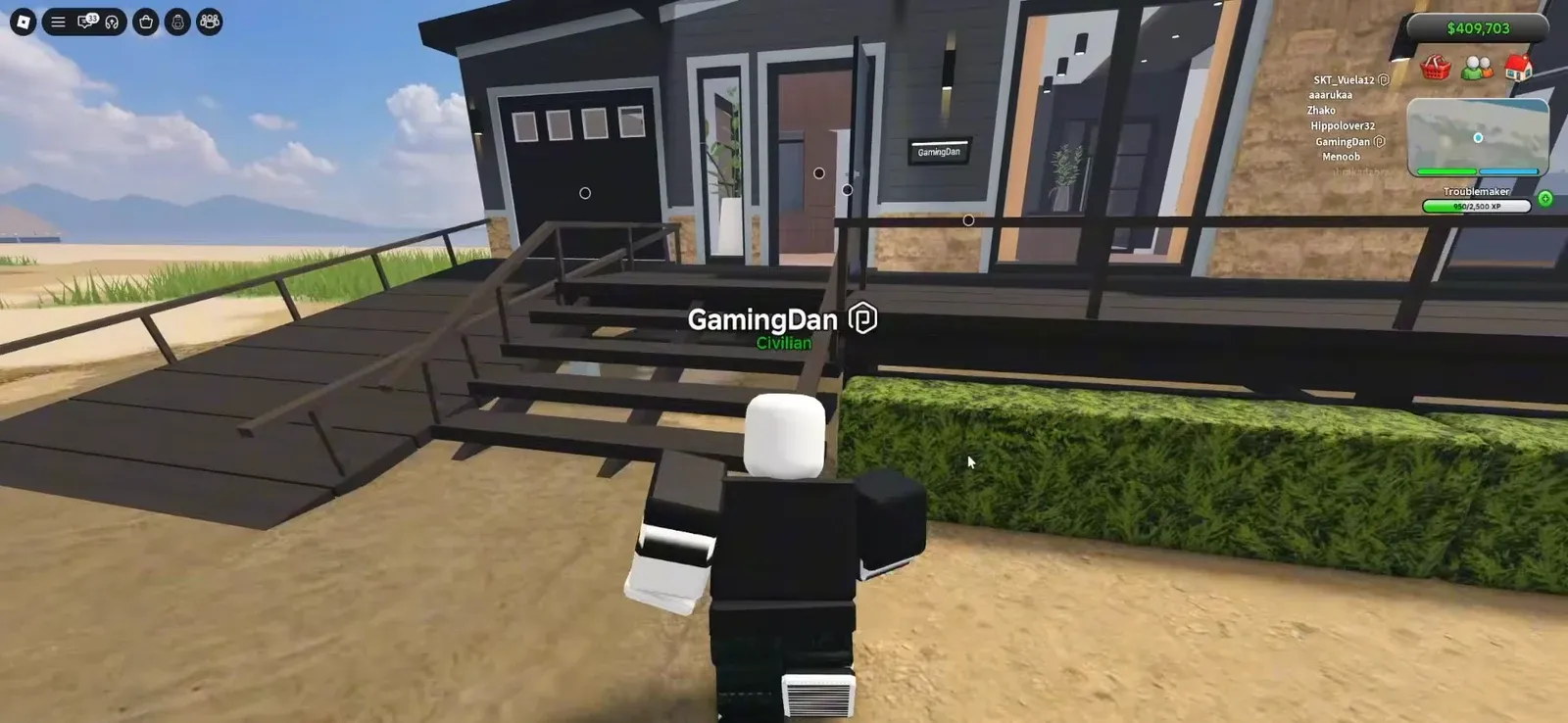Avatar approaching the beach house entrance with the INSIDE prompt showing