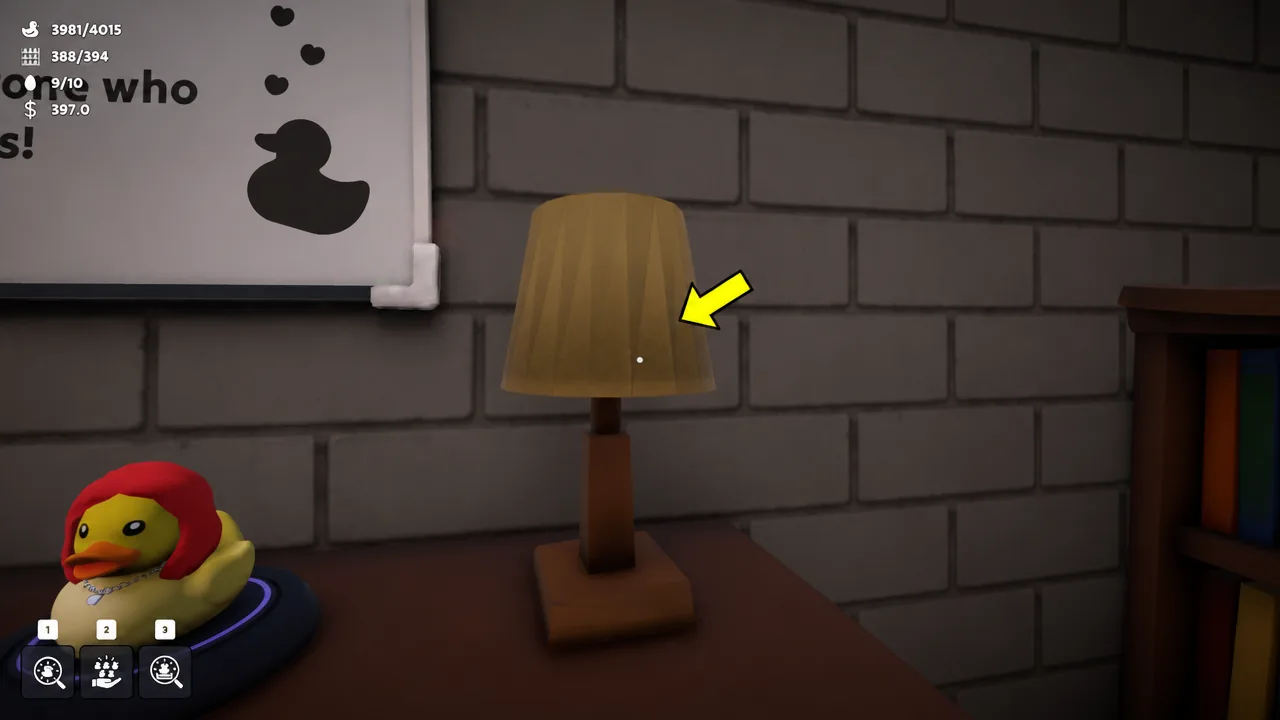 Yellow interaction arrow pointing at a table lamp in the office as the player targets it.