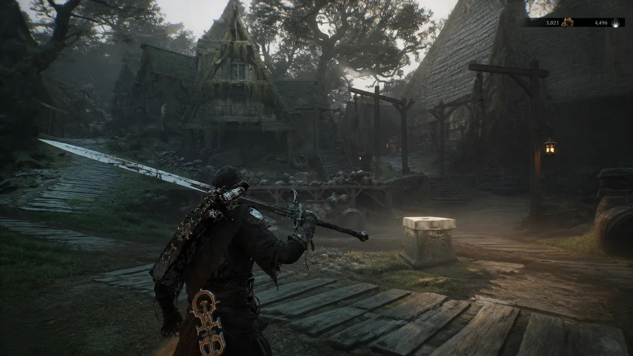 Player character holding a large sword in a dim Mushroom Village courtyard