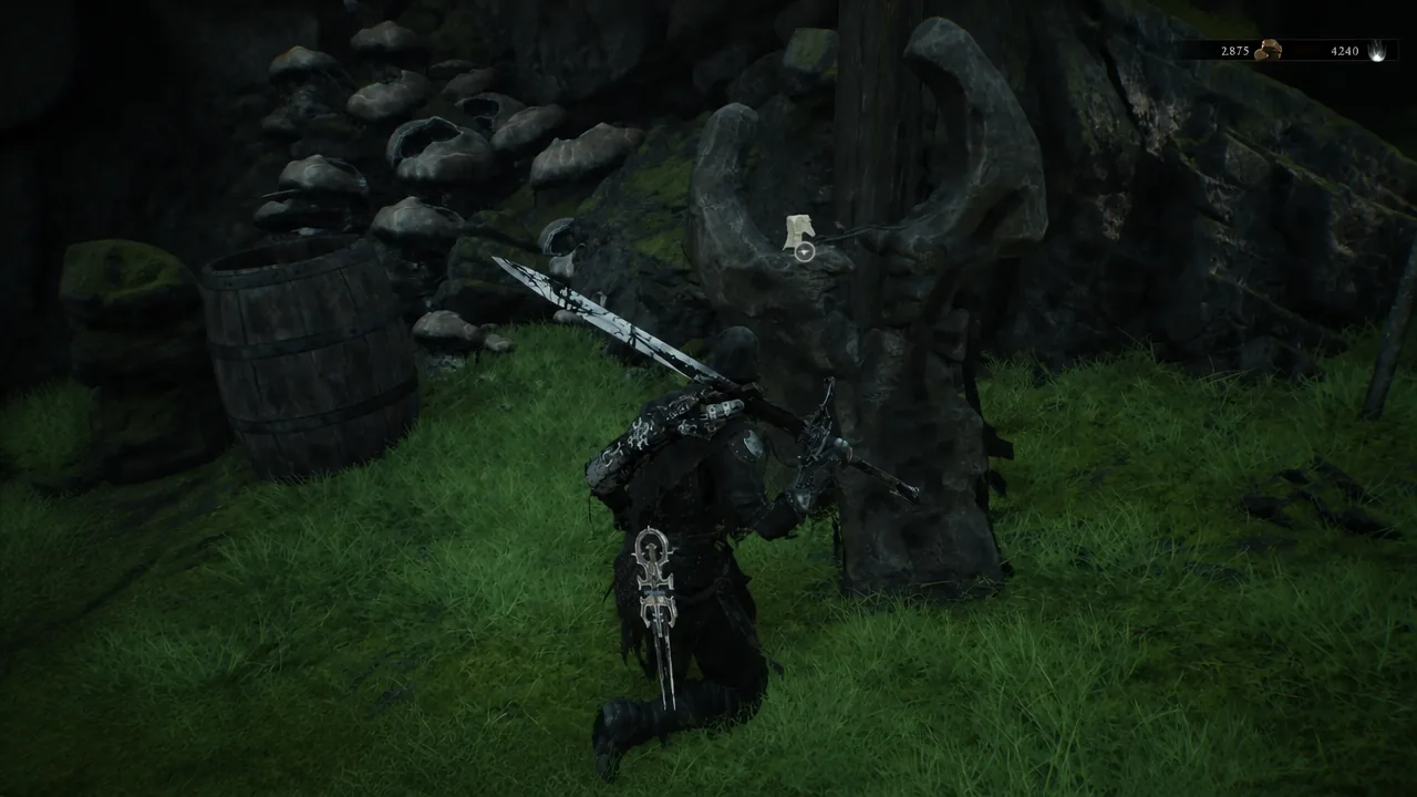 Character kneeling beside a stone monument with the interact prompt on screen