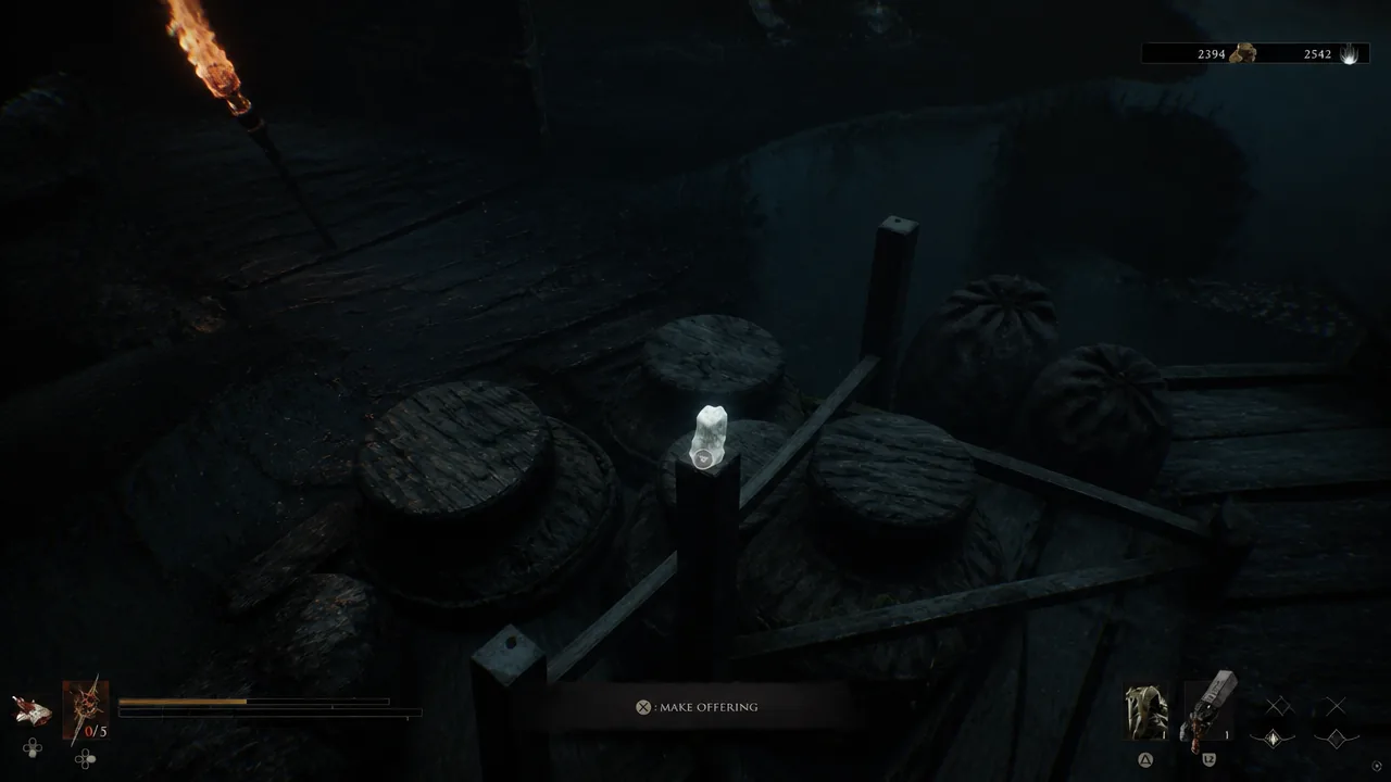 Interaction prompt reading MAKE OFFERING on a glowing candle in the Sunken Village