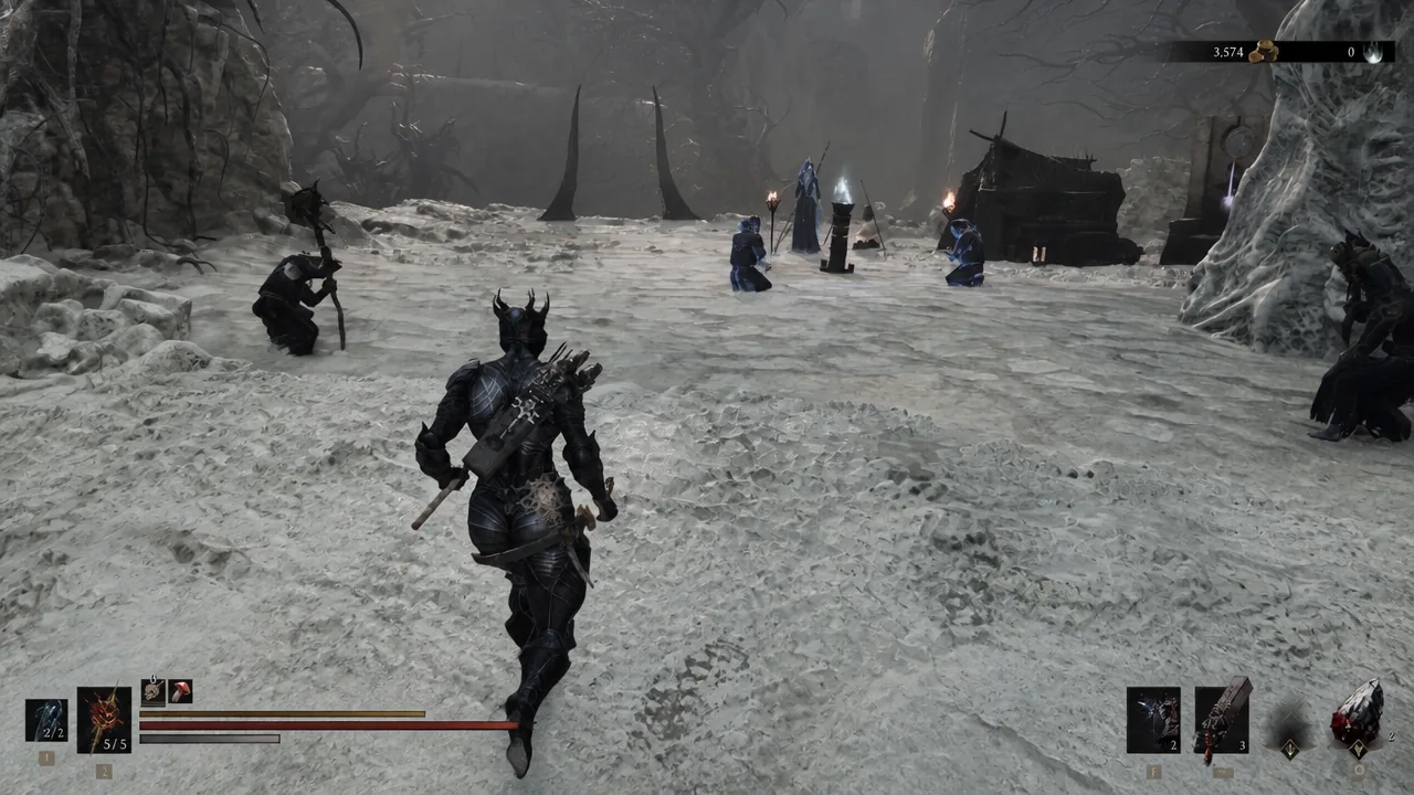 Player character running past a group of blue-robed cultists gathered by a camp in a snowy cavern