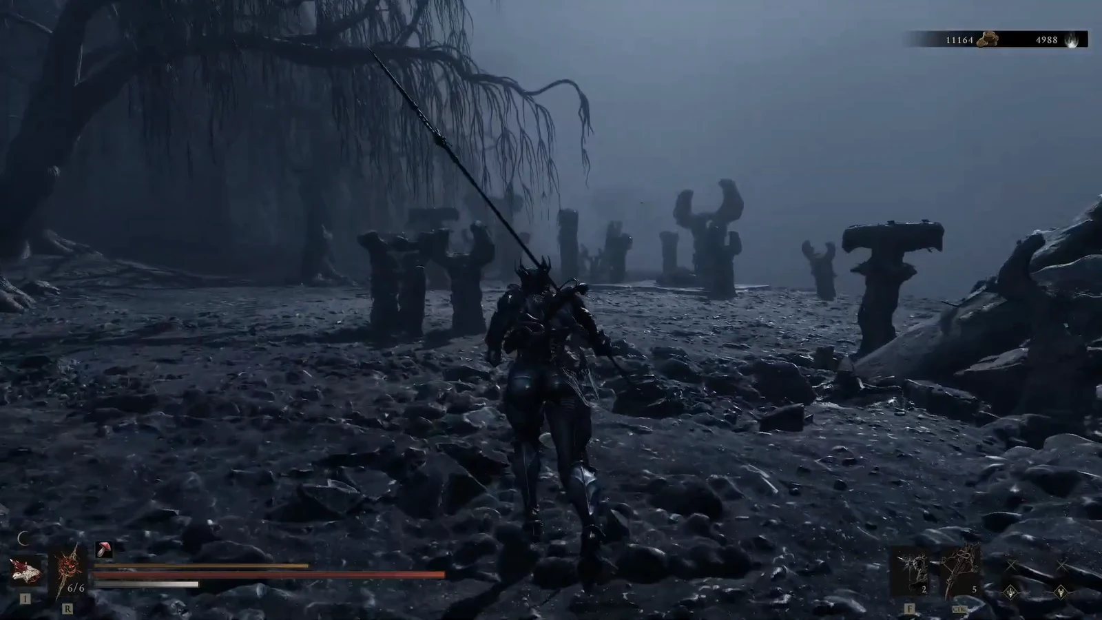 Player character running across a rocky battlefield toward horn-shaped stone pillars