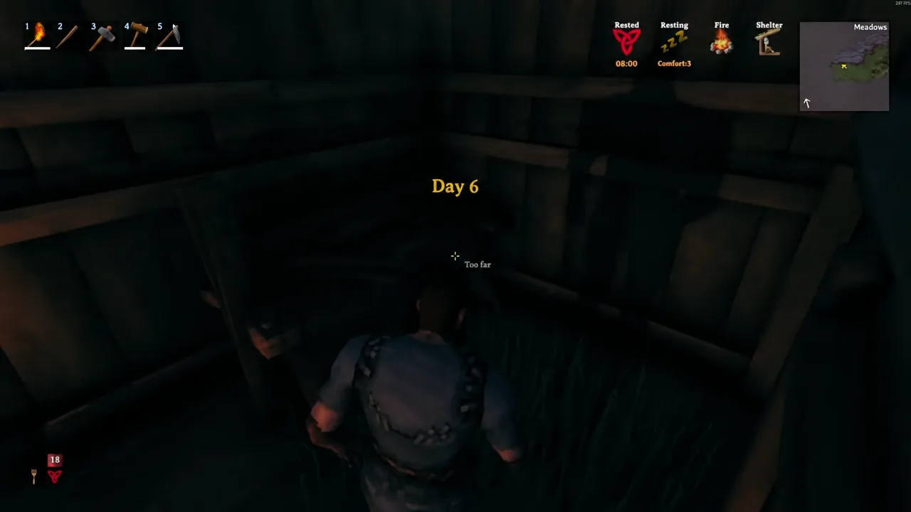 Valheim HUD showing a Too far message while the player aims at an out-of-range build spot