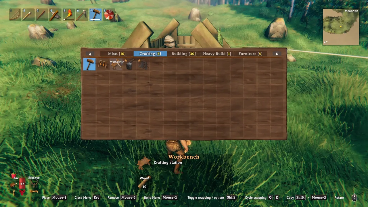 Valheim crafting menu open on the Workbench entry before placing it near an abandoned building