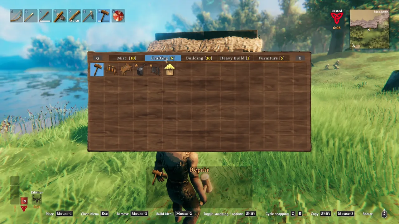 Player harvesting honey from beehives built at a Valheim base