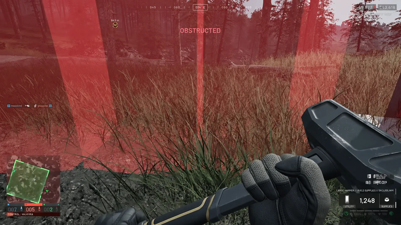 Build mode with the Large Hammer equipped showing a red OBSTRUCTED placement warning