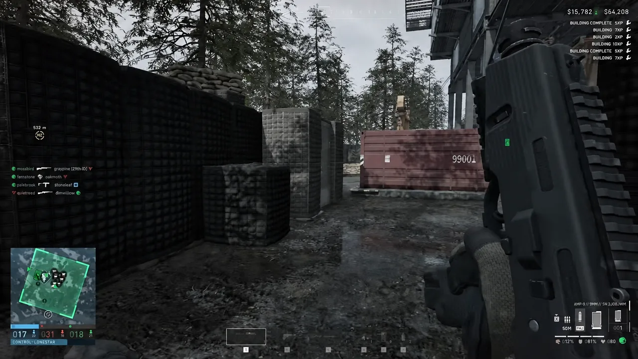 Improvised raised fighting position built from paired HESCO blocks topped with sandbags