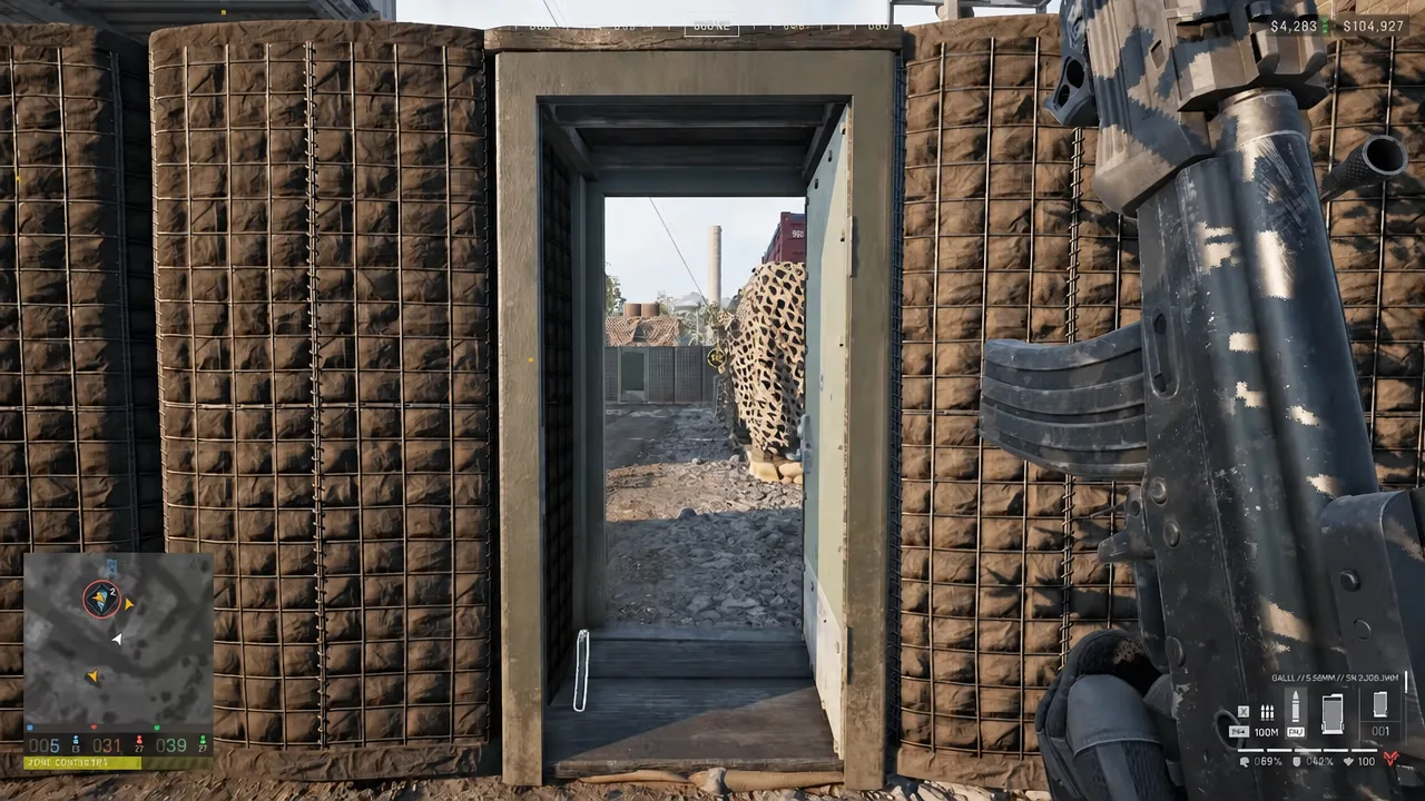 A player aims a rocket launcher straight through an open doorway in a FOB wall
