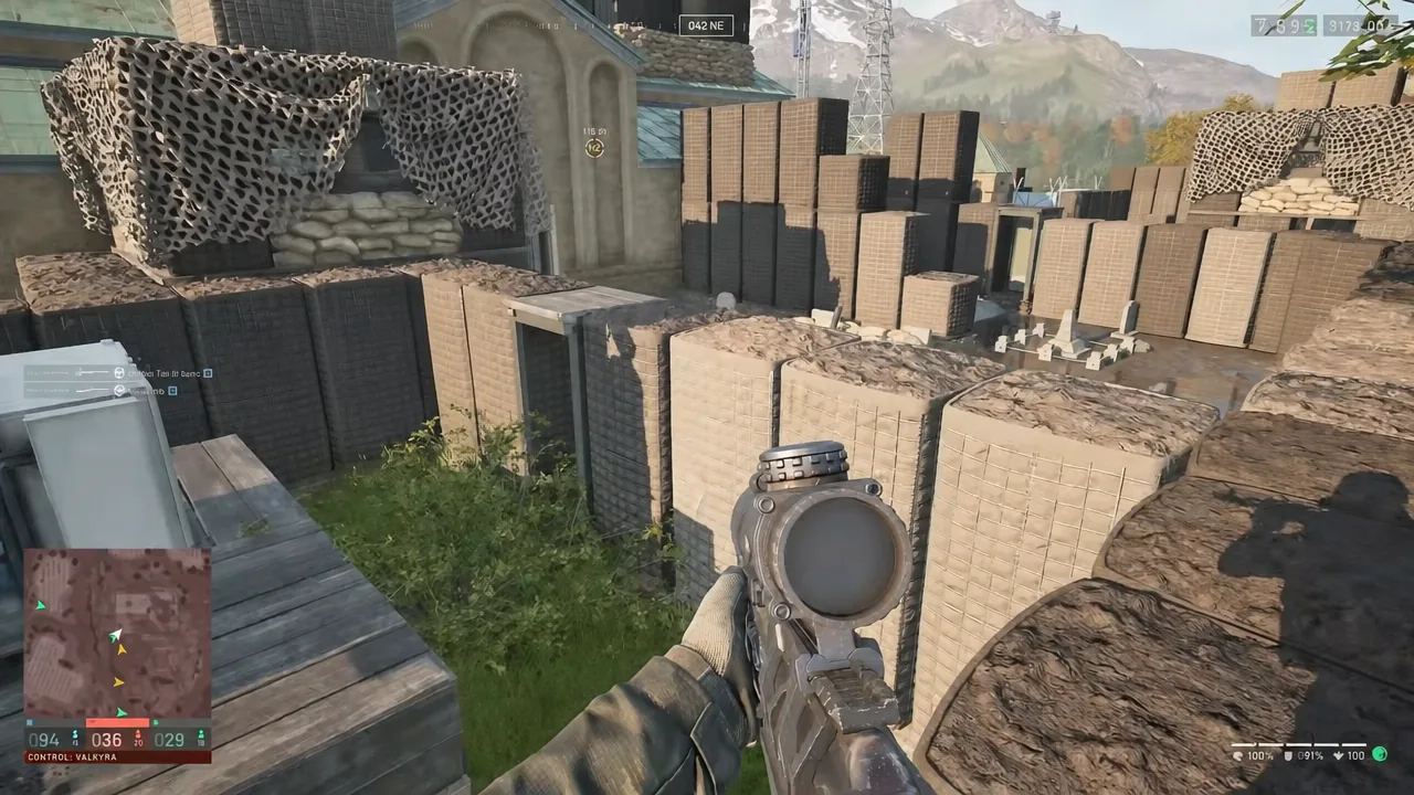 Aiming a rifle over sandbag barricades at a fortified position in WARDOGS