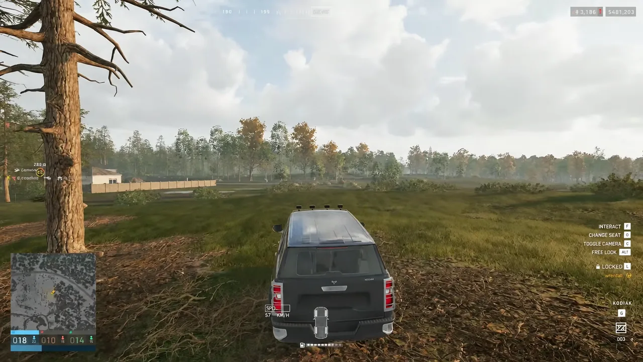 Driving an SUV in WARDOGS with the INTERACT prompt and seat and camera controls shown on the right
