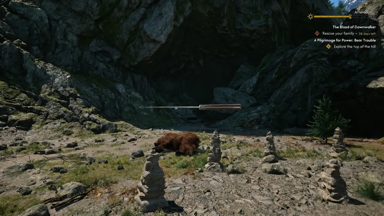 Coen facing the Ravenous Bear on the hilltop clearing with the Bear Trouble quest on the HUD