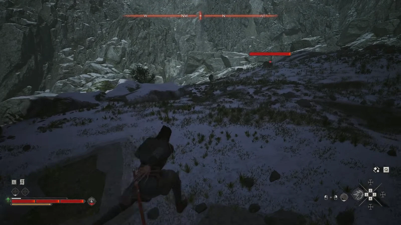 Coen closing on a wolf marked with a red health bar on a snowy mountain slope