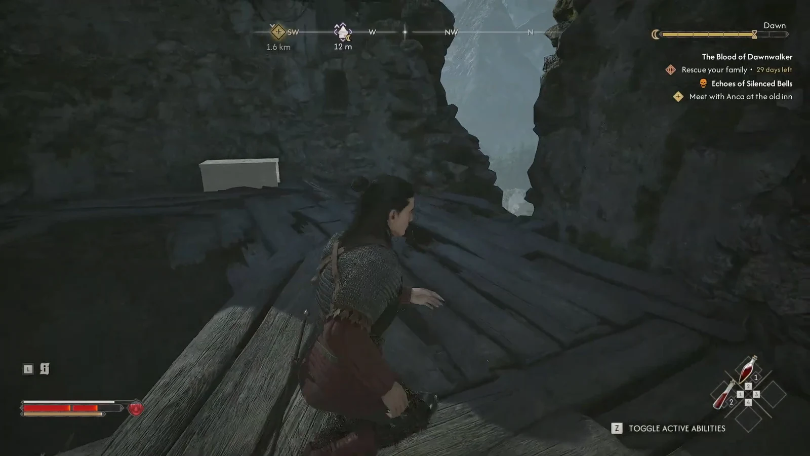 Character crossing a wooden platform between rock faces with a 12 m compass marker ahead