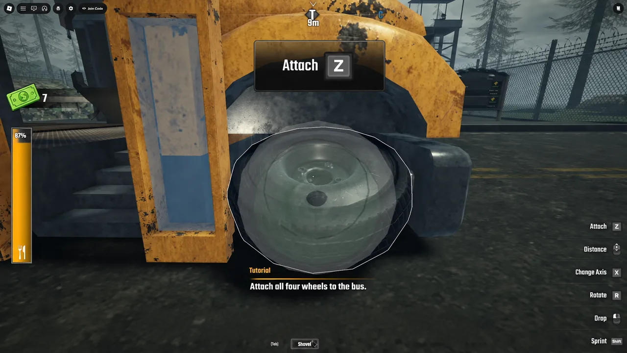 Tutorial prompt highlighting the attach key while a wheel is fitted to the bus