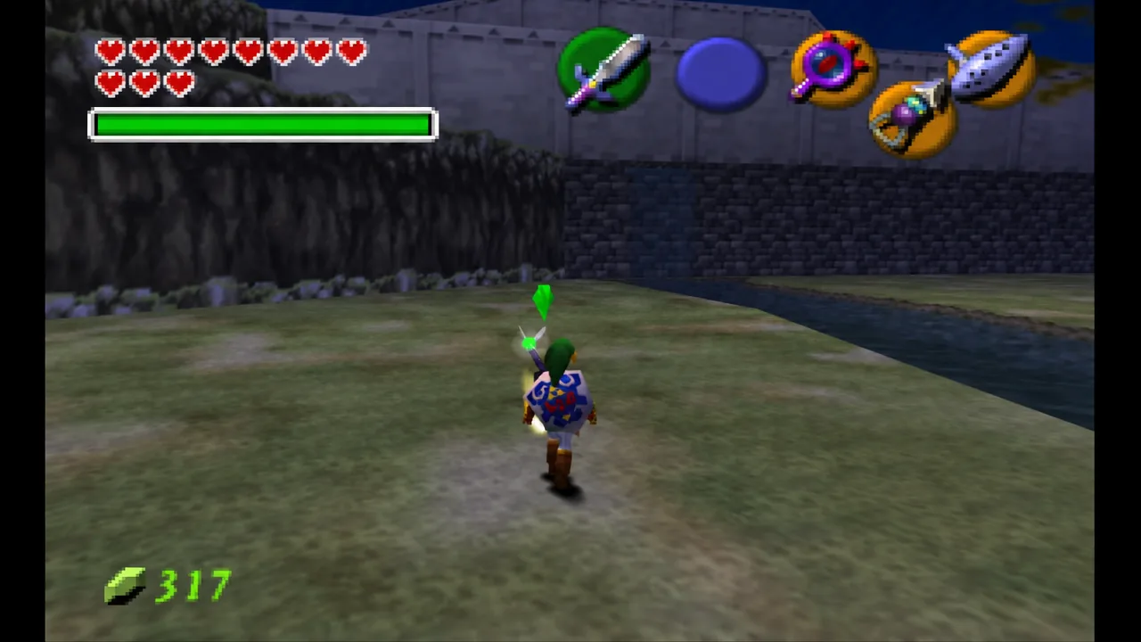 Child Link crosses a grassy area with his sword equipped to the B button slot