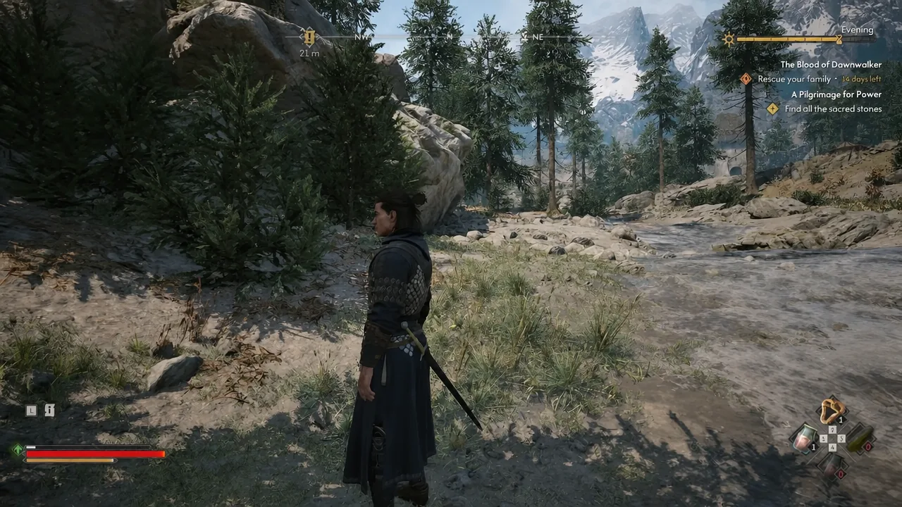 Coen climbing the rocky mountain path toward a highlighted 21m objective marker