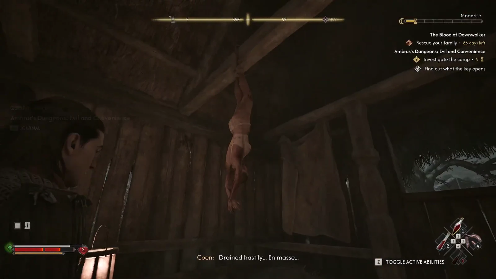 Coen stands under a hanging corpse inside the barn with the Find out what the key opens objective showing