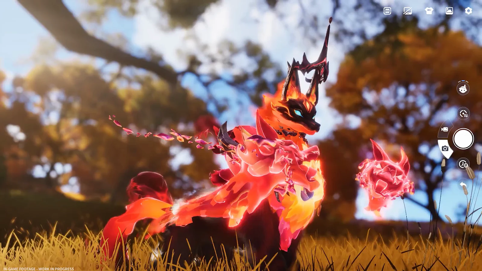 A fiery foxlike creature poses among tall grass and autumn trees in daylight.