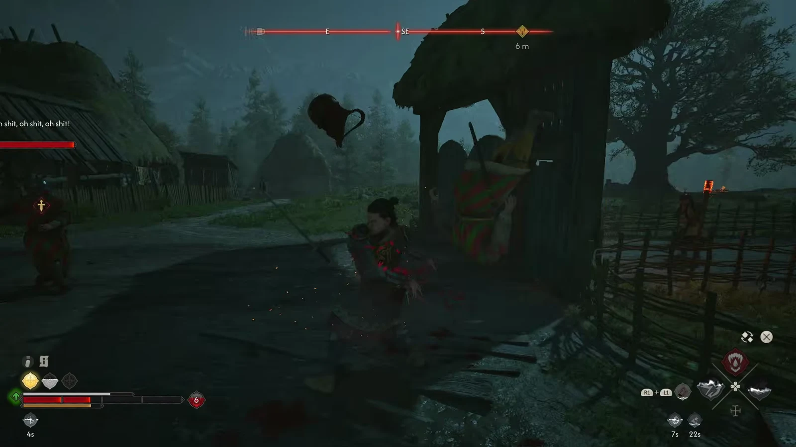 Night-time combat in the village with the ability prompt showing on the combat HUD