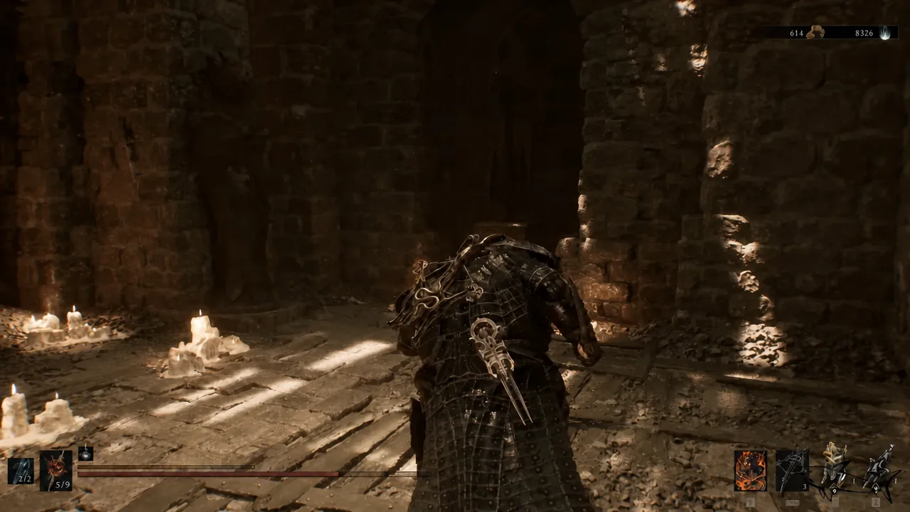 Player crossing a candlelit stone chamber on the way down through the dungeon