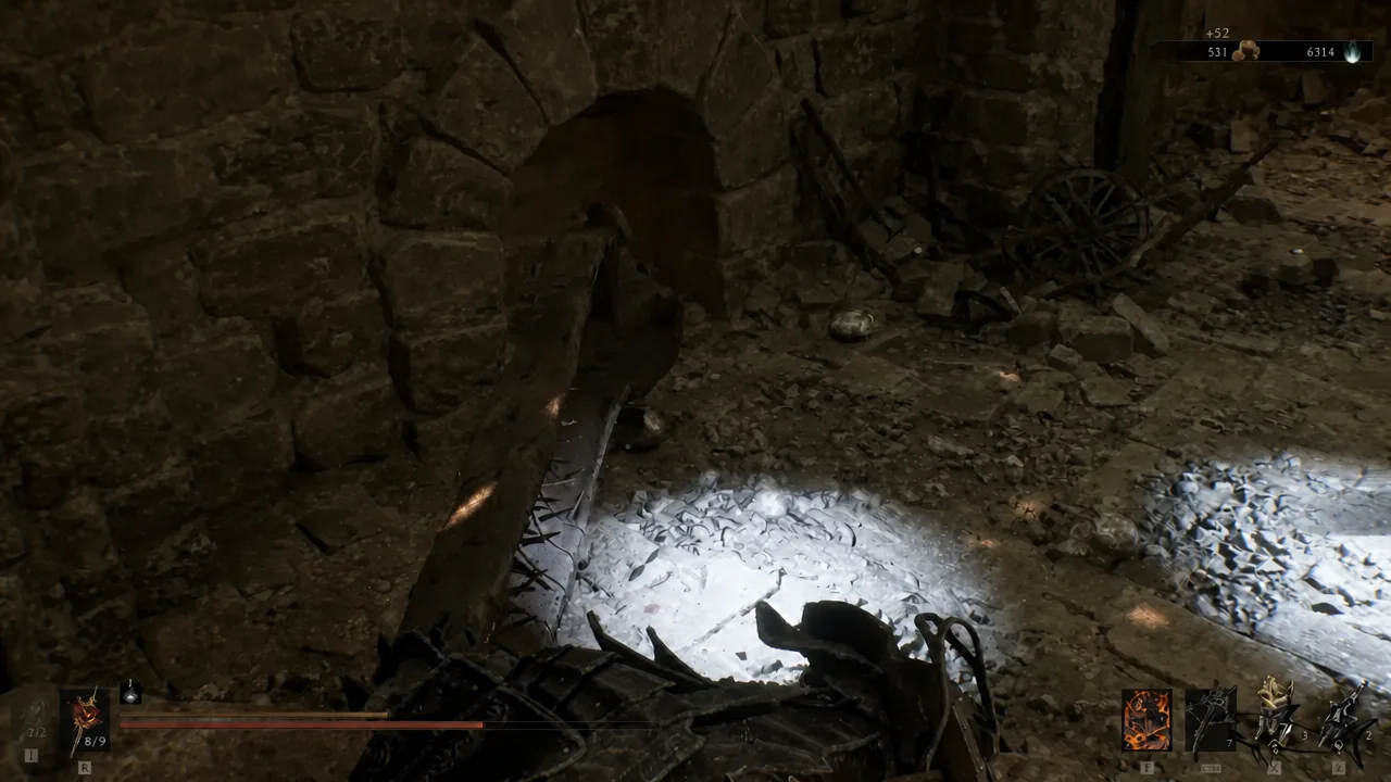 Player moving through a rubble-strewn stone passage inside Sentry's Grave