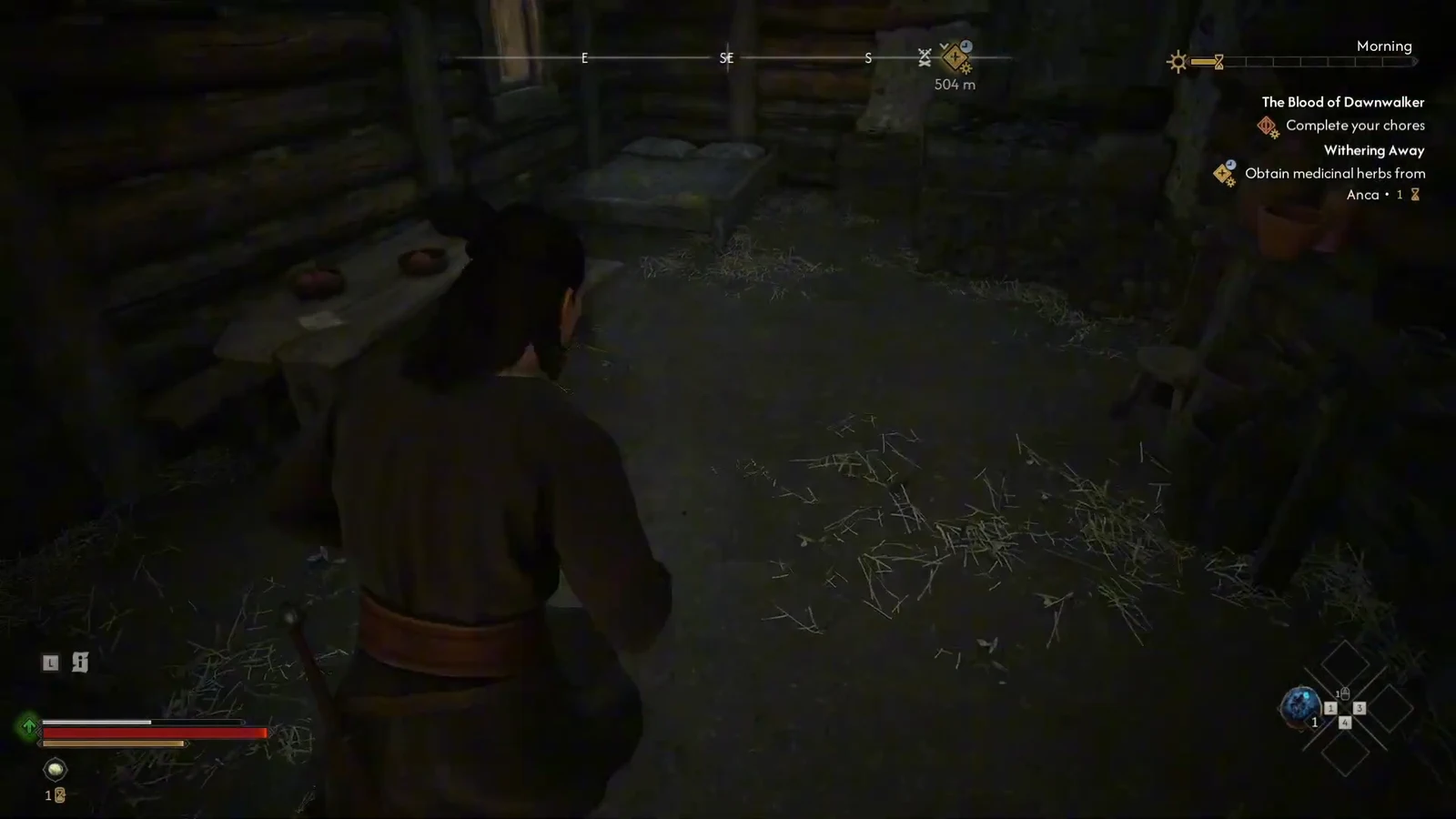 Coen searching the dim interior of the bandit house where the treasure map sits on a table