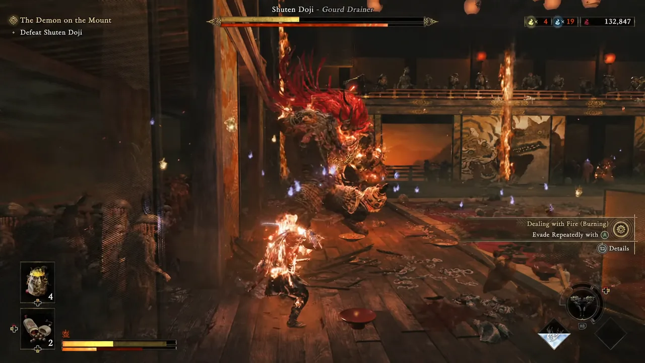 On-screen Dealing with Fire prompt telling the player to evade repeatedly while burning