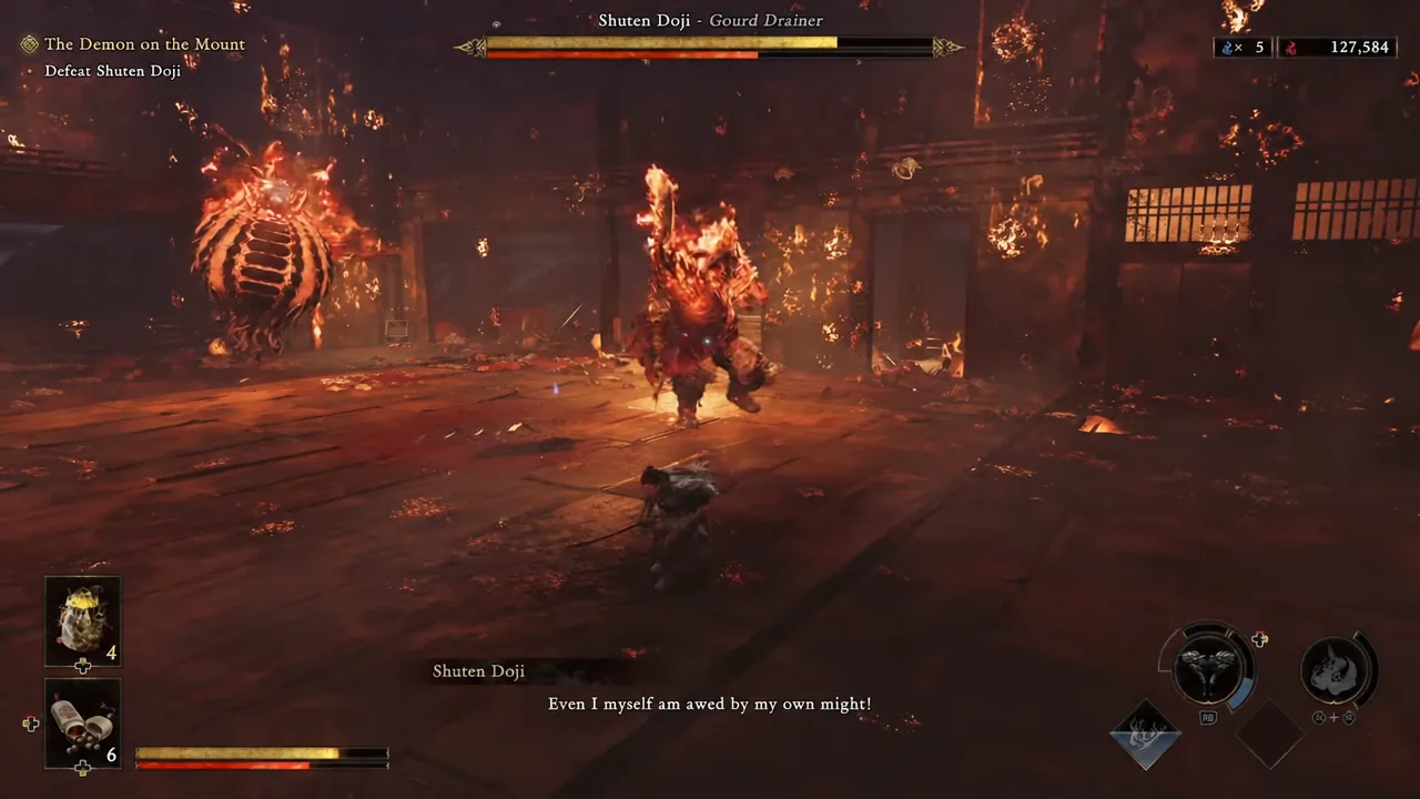 Musashi attacking the flaming Shuten Doji with the second-phase boss health bar on screen