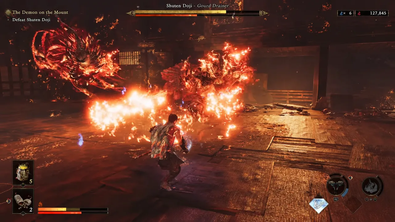 Musashi facing the burning Shuten Doji with fire spreading across the temple floor