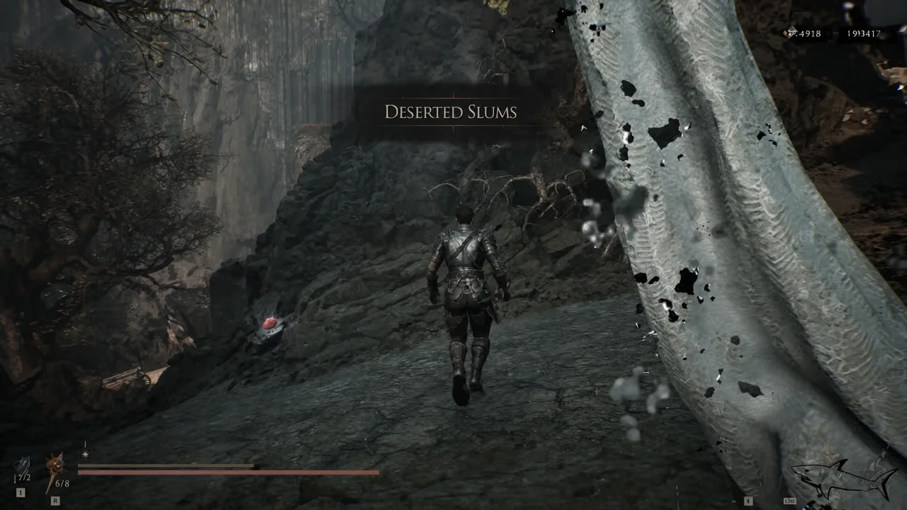 Deserted Slums area banner appears as the player runs along the rocky path