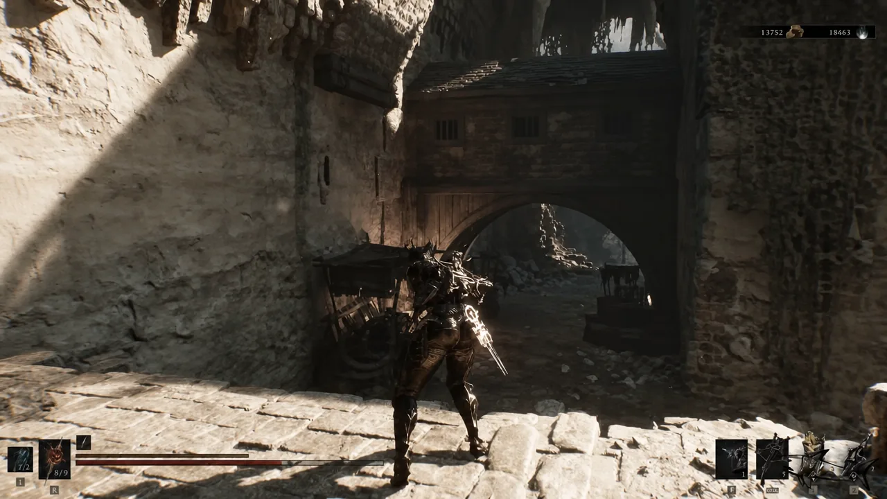 Armored character walking toward a large stone archway in the ruins