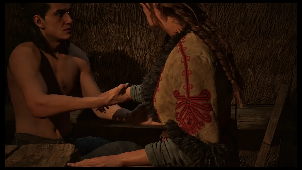 Anca and Coen talking by candlelight inside the cabin after their quest together