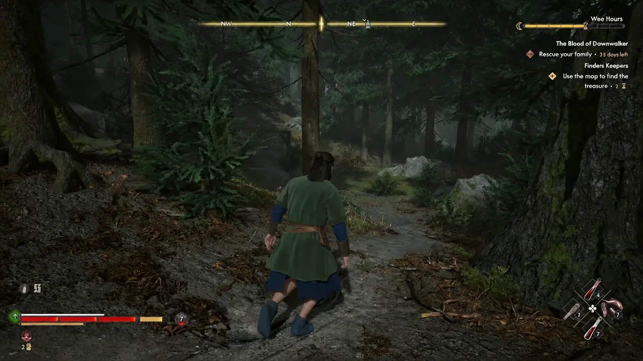 Coen crouch-walking through dense forest with the objective tracker on screen