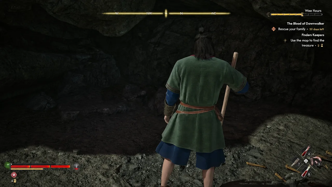 Coen moving through the shallow cave beneath the rock where the cache is buried