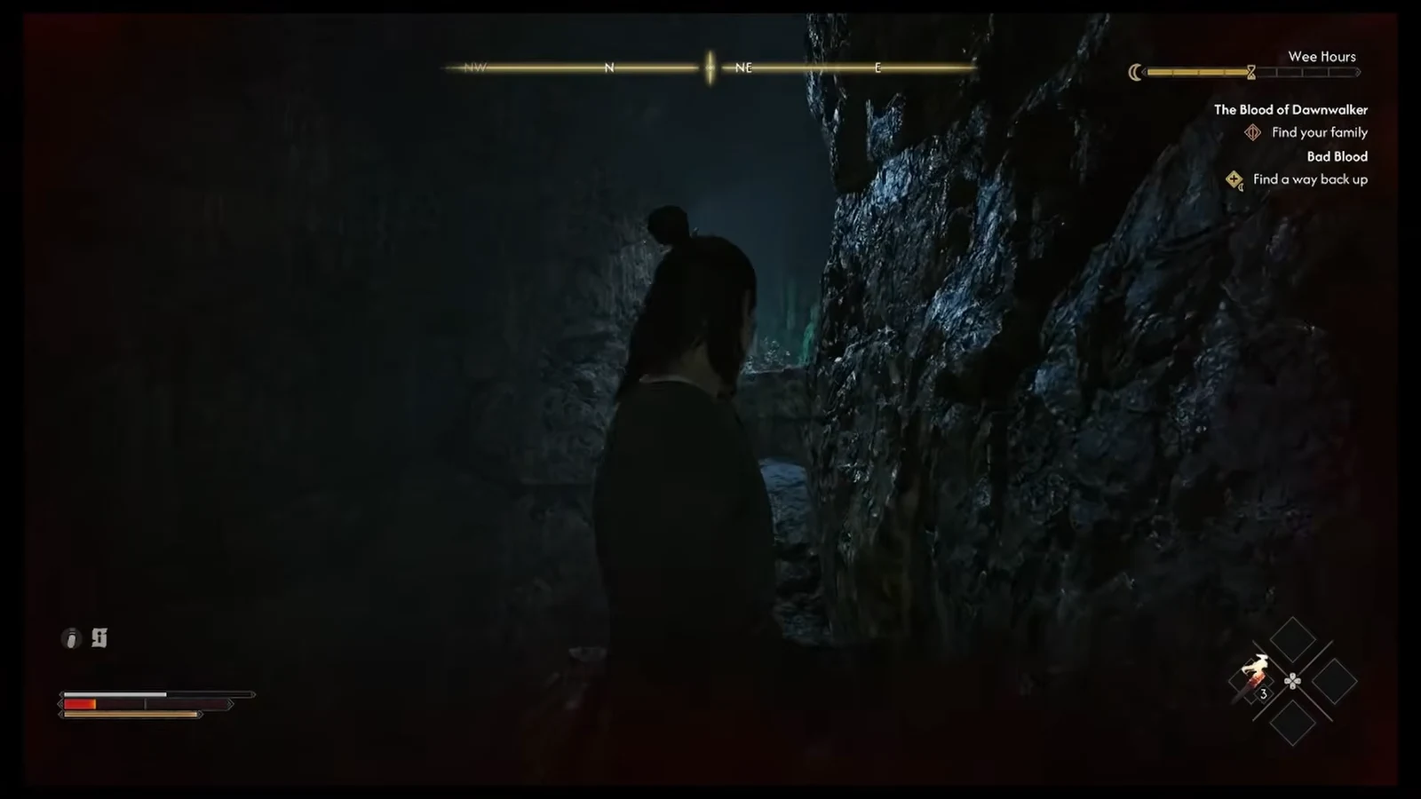 Coen moves through a dark mine passage with the Bad Blood objective Find a way back up on screen