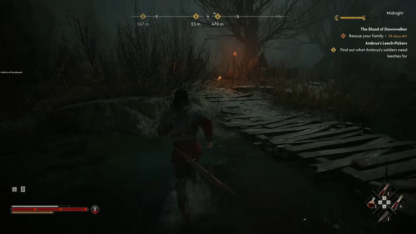 Coen crosses a dark wooden walkway toward the torchlit leech camp in the bog