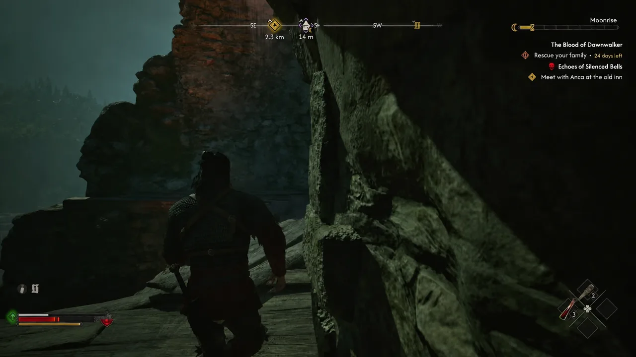 Coen walks along a narrow wooden walkway near the top of the tower with the compass on screen