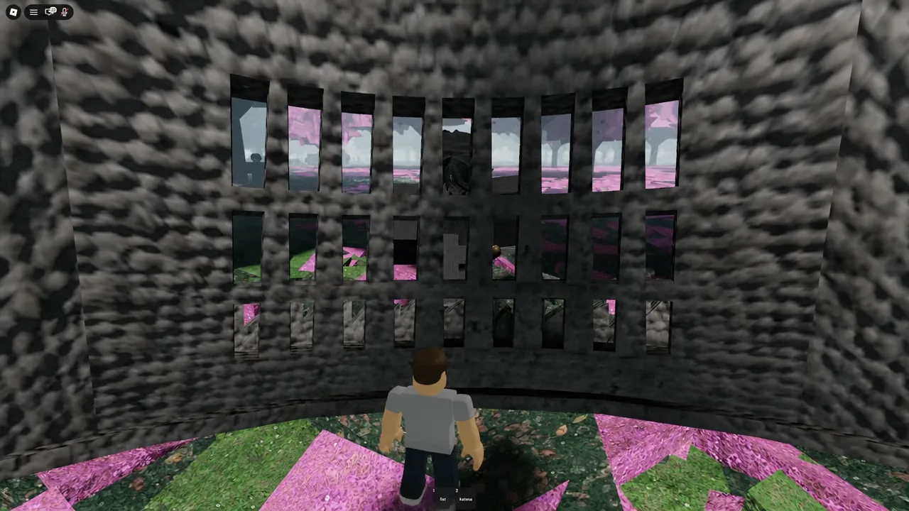 Player character inside an enclosed stone room facing a wall with narrow window slits