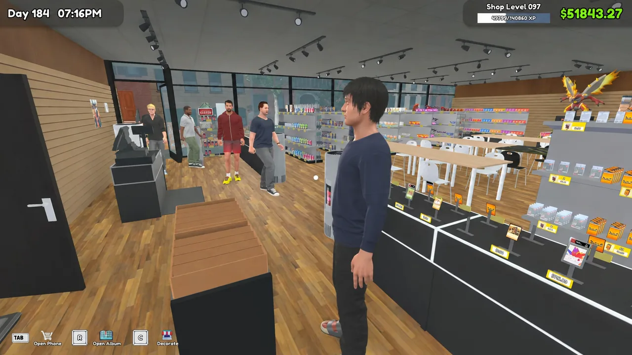 Shop floor view with stocked shelves, browsing customers and card play tables