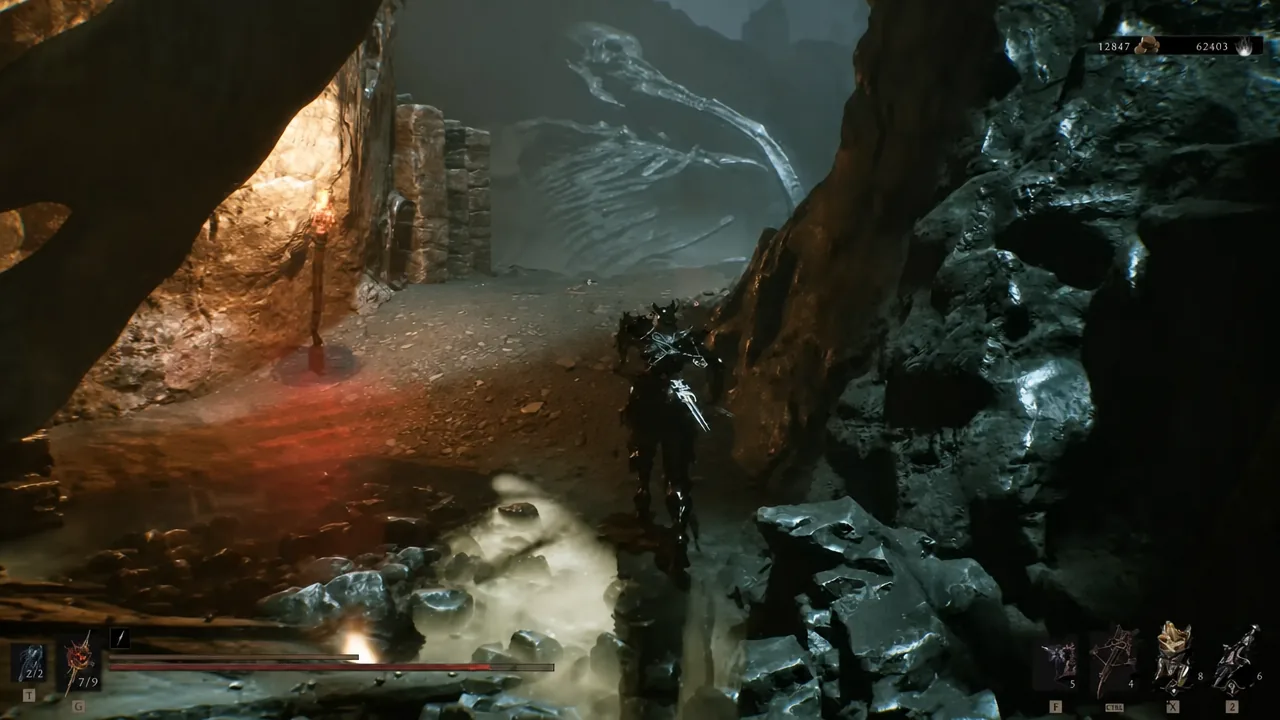 Running through a rocky cavern in Withered Shoals past a huge skeletal creature