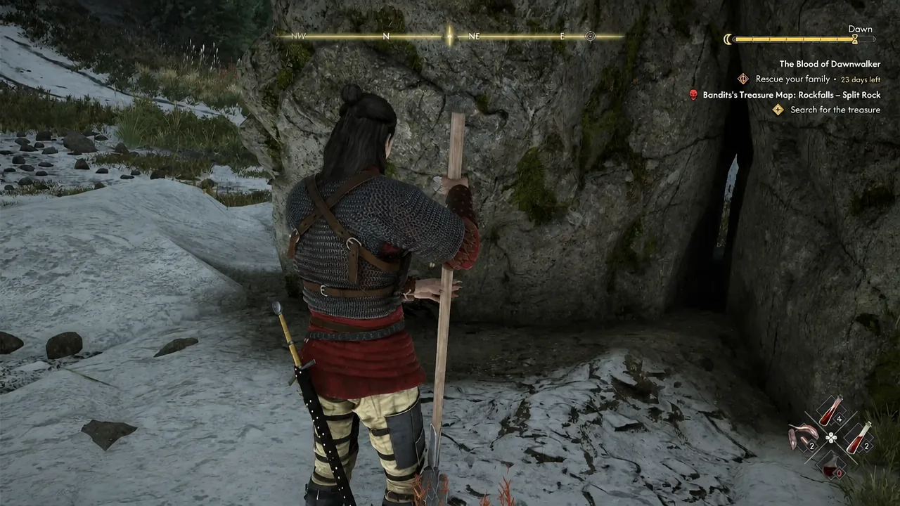 Quest tracker showing the Search for the treasure objective as Coen nears a cave entrance