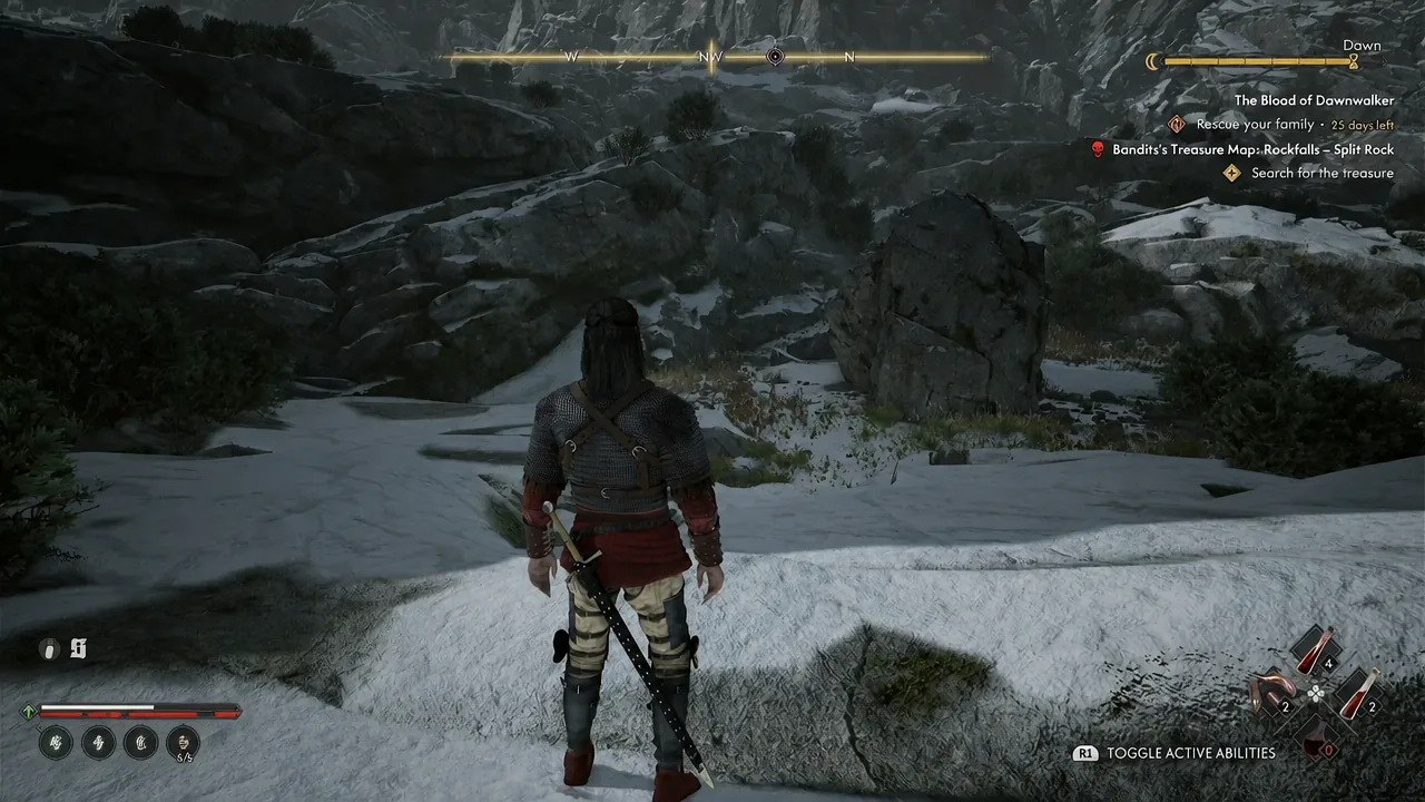 Coen climbing snow-covered rocks in Rockfalls while the treasure map quest is tracked