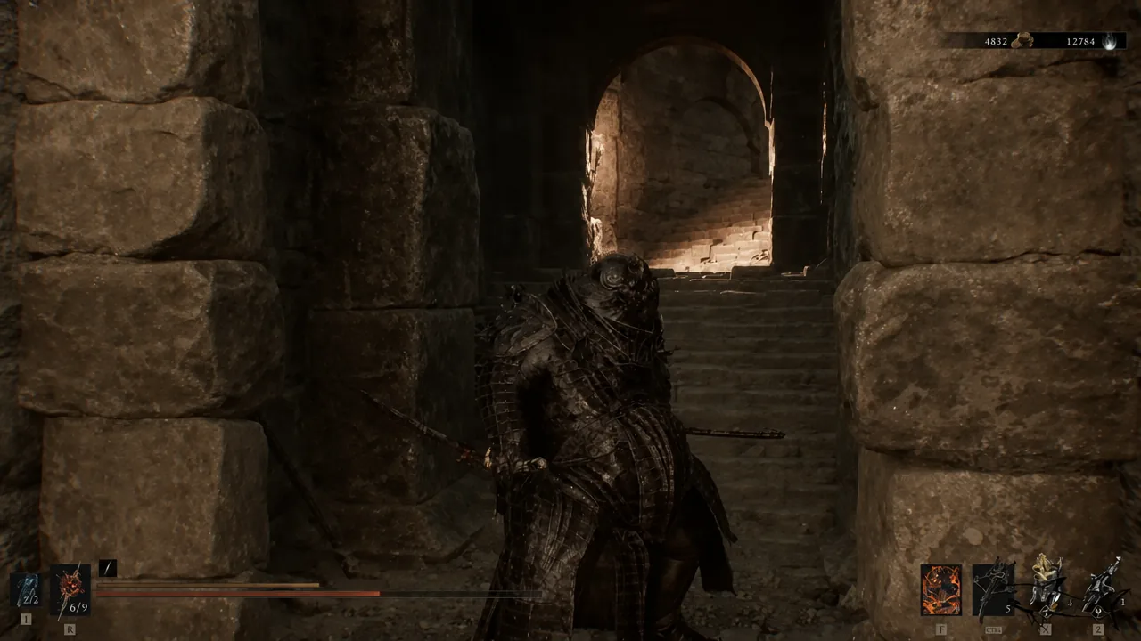 Player character advancing along a stone corridor at the bottom of the mine shaft