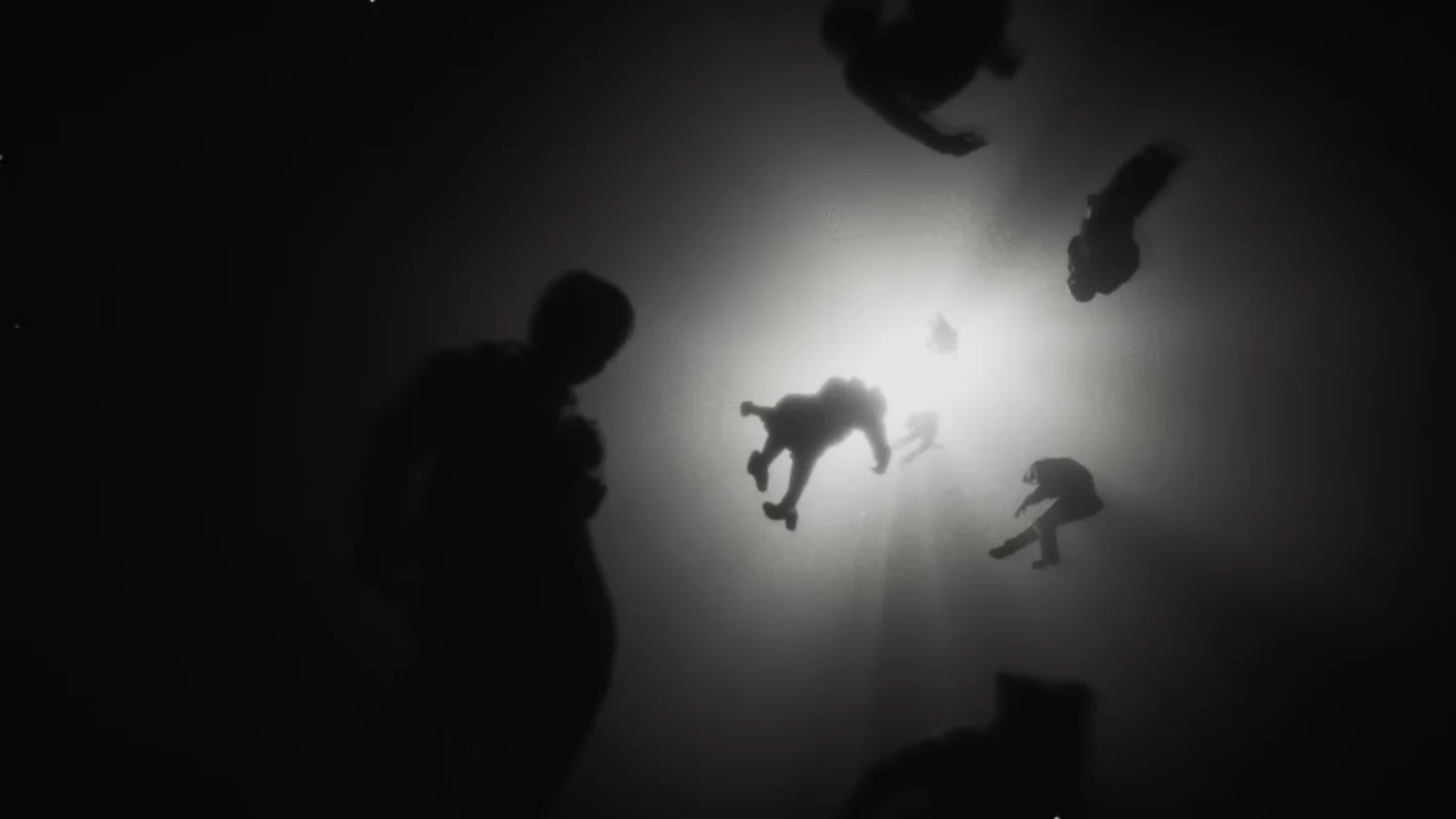 Black-and-white vision flash with hands reaching toward Dylan's face during the prologue