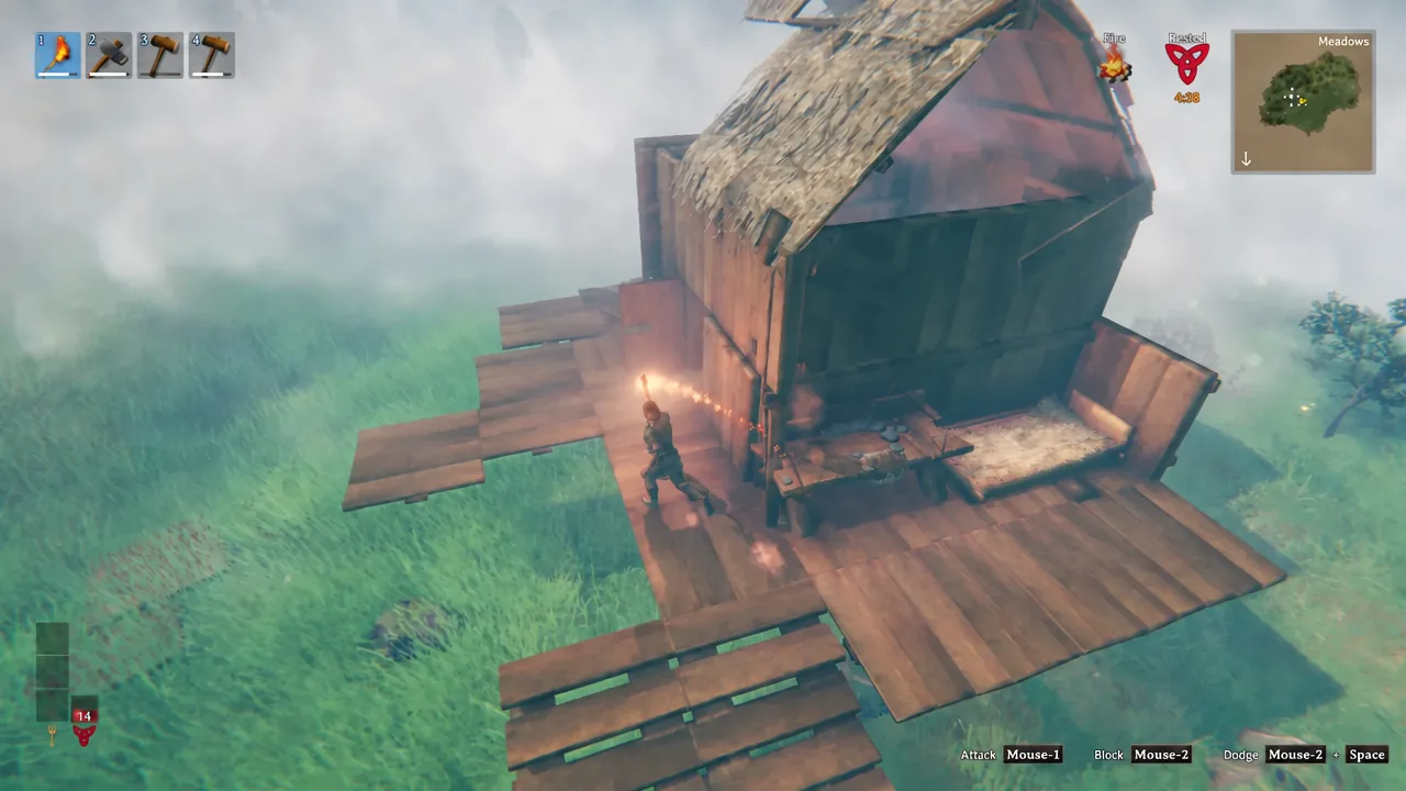 Valheim player holding a torch from hotbar slot 1 outside a wooden house